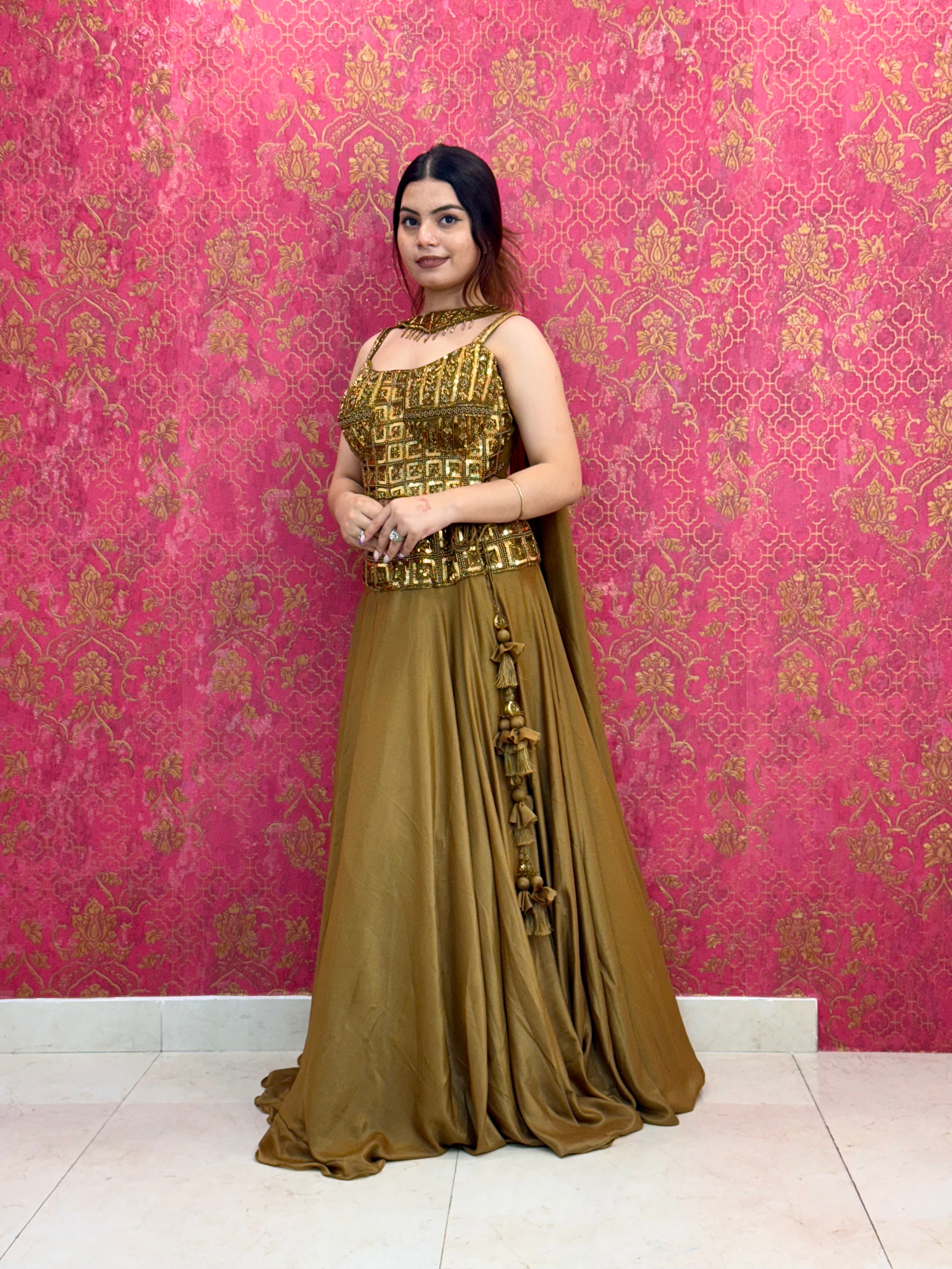 Elegant Mustard Gold Lehenga Choli Set with Decorative Blouse Detail and Tassels