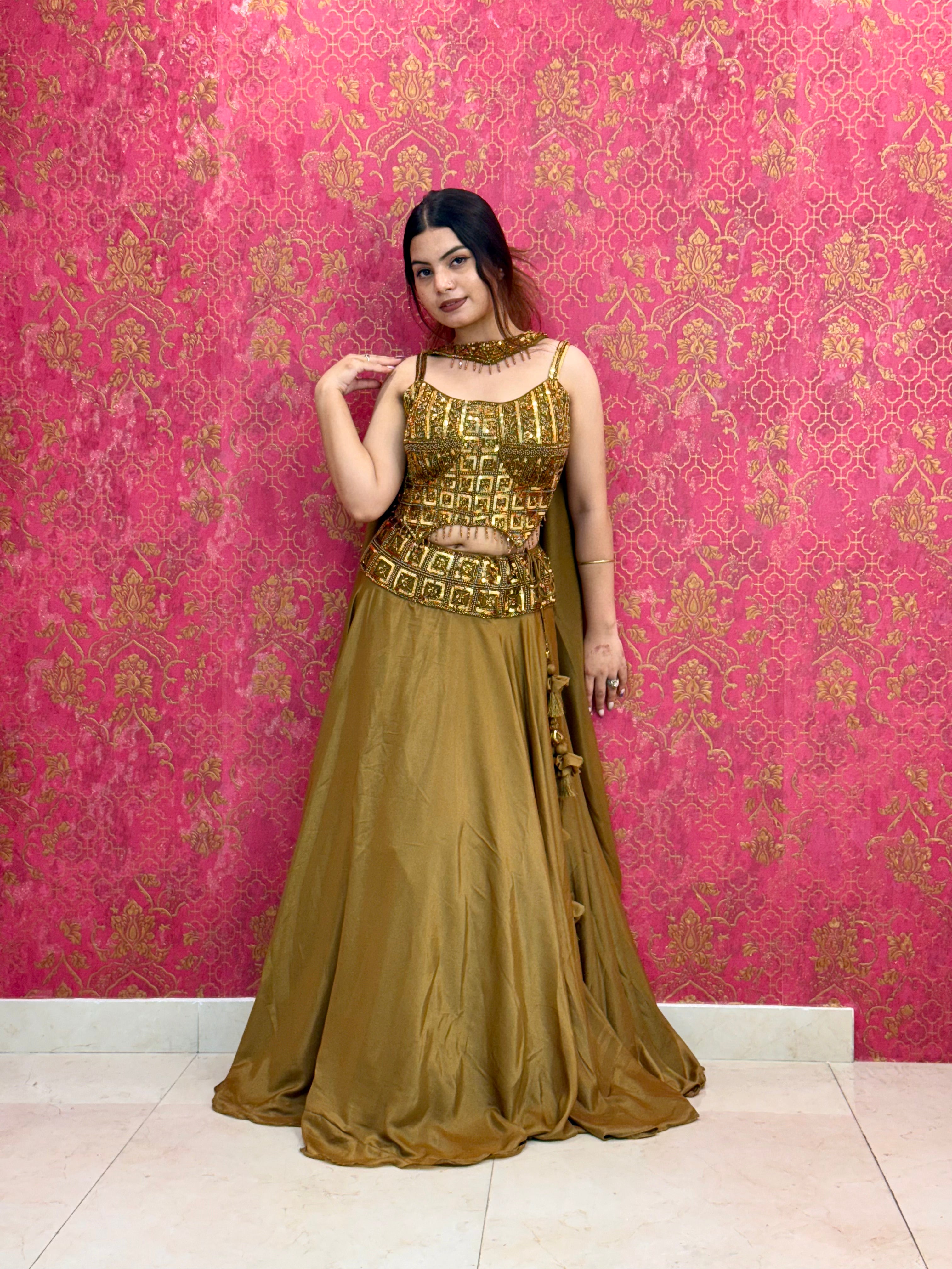 Elegant Mustard Gold Lehenga Choli Set with Decorative Blouse Detail and Tassels