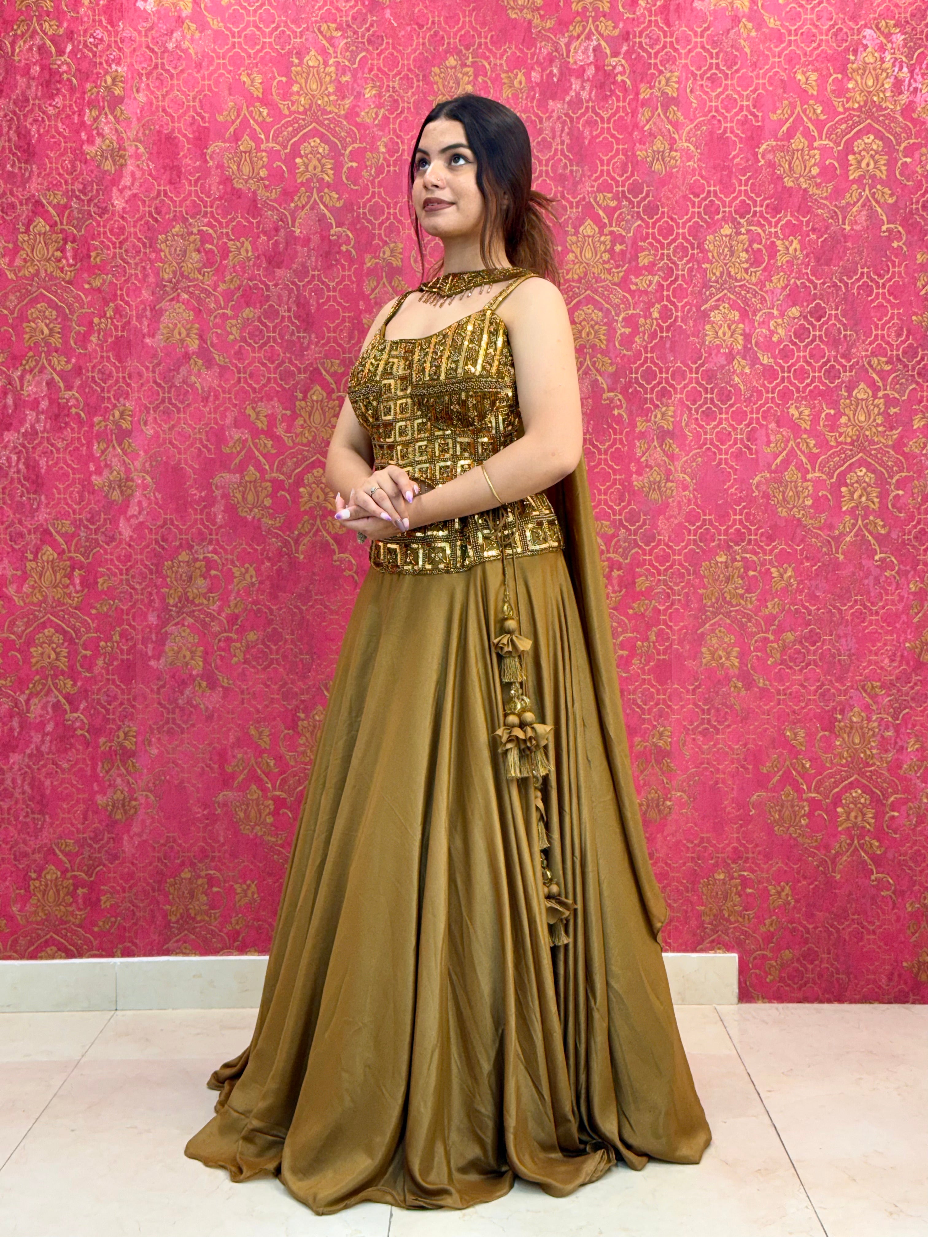Elegant Mustard Gold Lehenga Choli Set with Decorative Blouse Detail and Tassels
