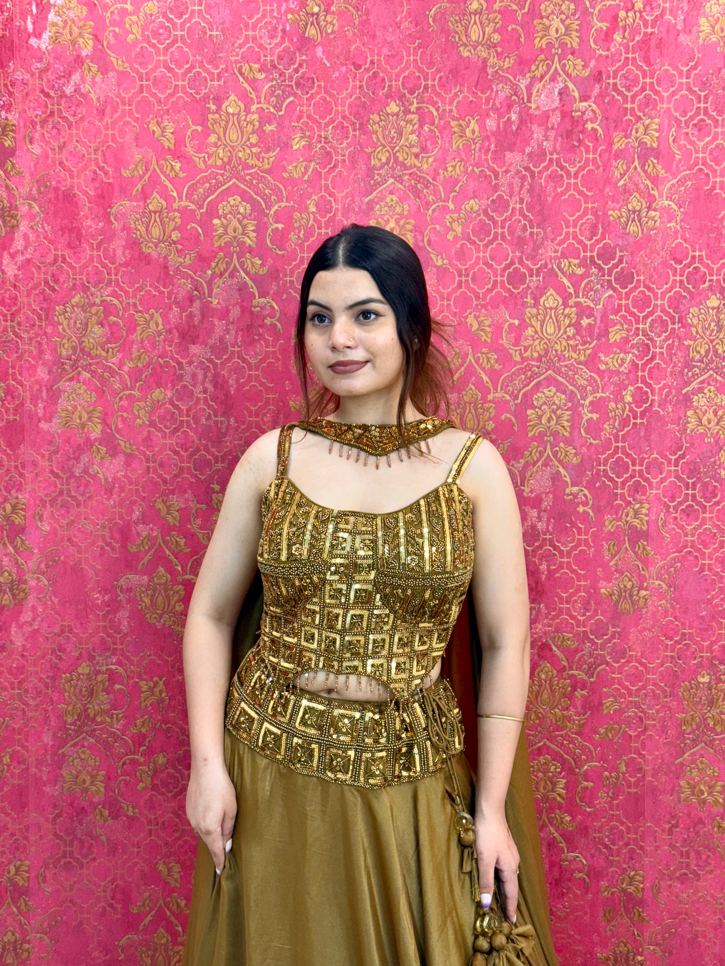 Elegant Mustard Gold Lehenga Choli Set with Decorative Blouse Detail and Tassels