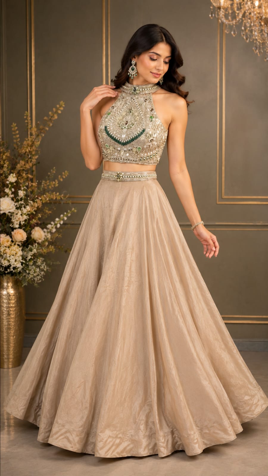 Golden elegance paired with a statement halter neck & intricate emerald detailing for the perfect royal look